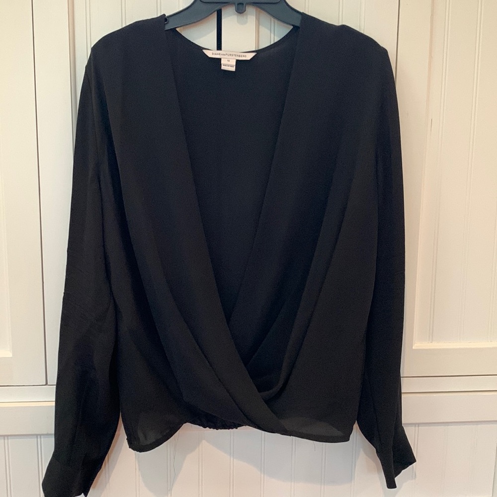 DVF semi-sheer black silk faux wrap blouse.